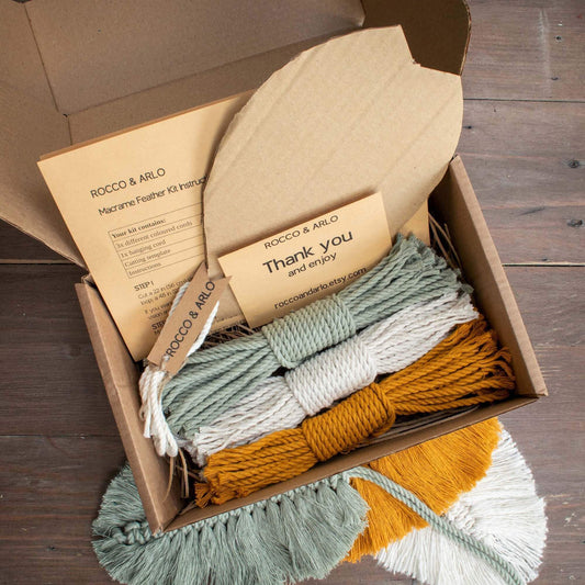 diy macrame kit in box for a trio of sage green mustard yellow and natural feathers
