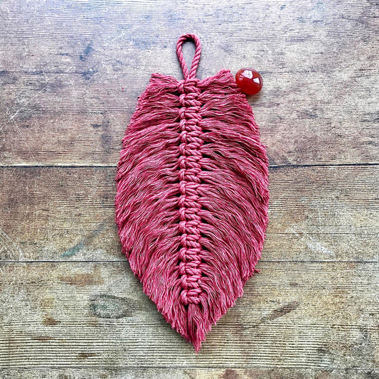 cinnamon red macrame feather with a carnelian tumbled stone