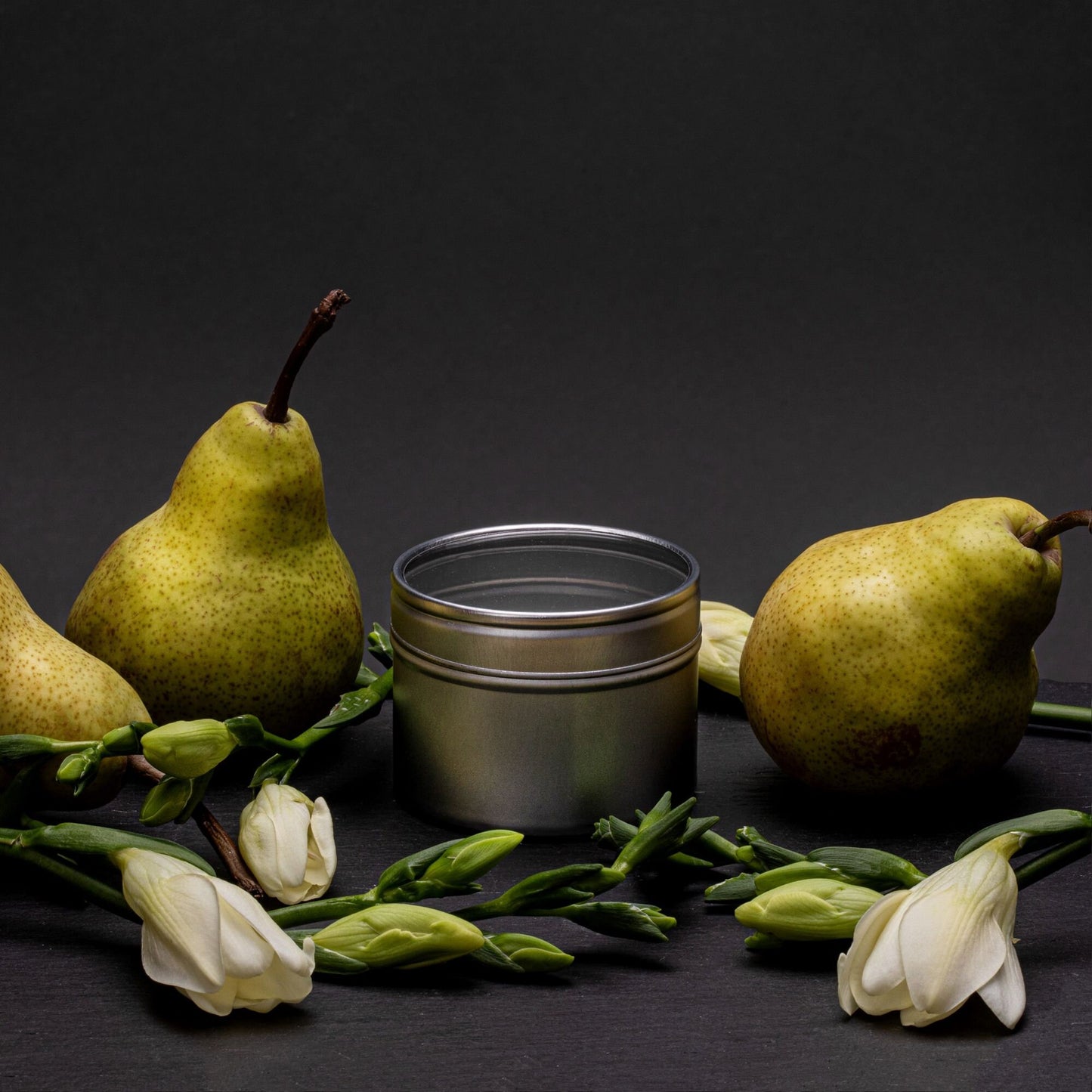 pear and freesia scented tin candle