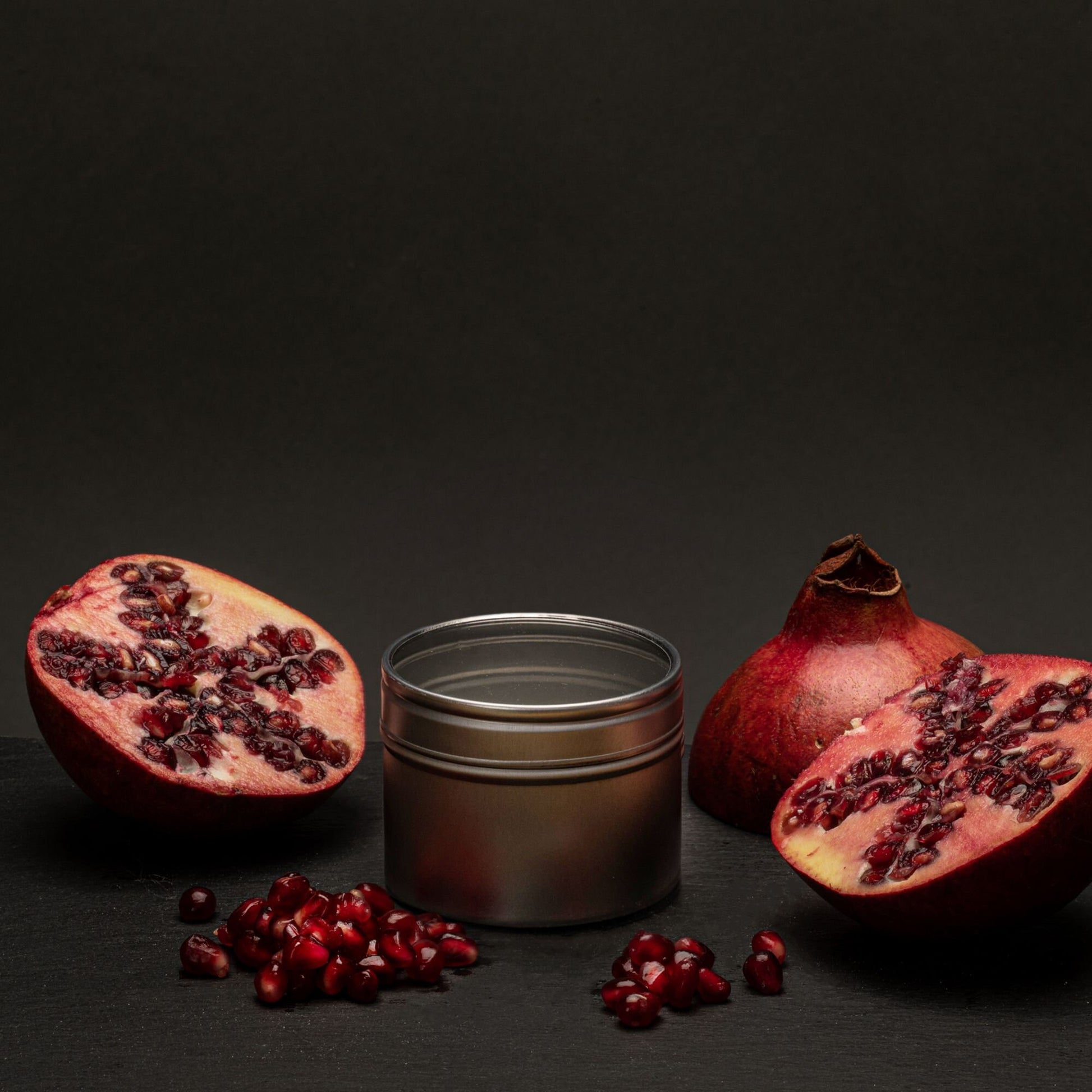 black pomegranate scented tin candle